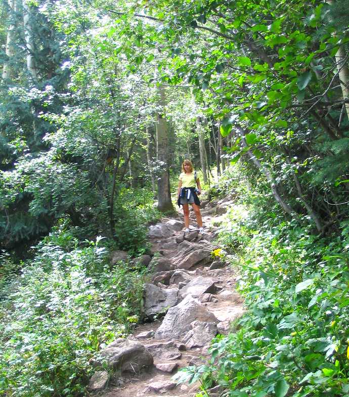 Hiker on rock trail in Rocky Mountain National Park